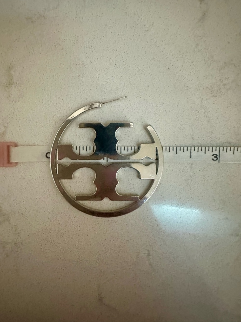 Tory Burch Logo Cutout Hoop Earrings in Shiny Silver - Picture 2 of 3